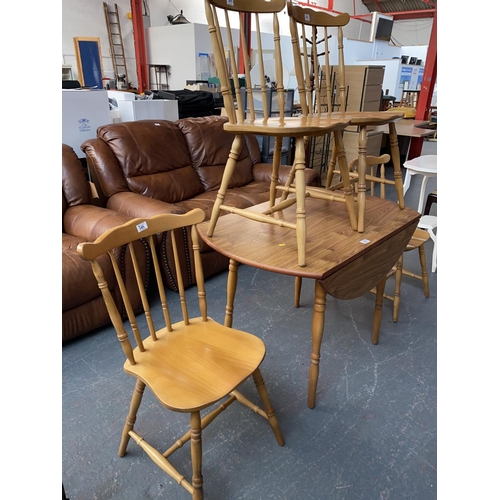 385 - A dining table and four chairs