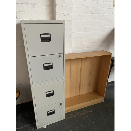 310 - A bookcase and four drawer filing cabinet