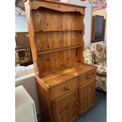 327 - A pine dresser with two drawers and two cupboards