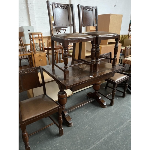 354 - A draw leaf dining table and four chairs