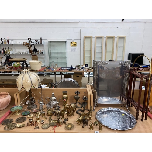 29 - A mixed selection of brass and metalware including candlesticks, fire screen etc.