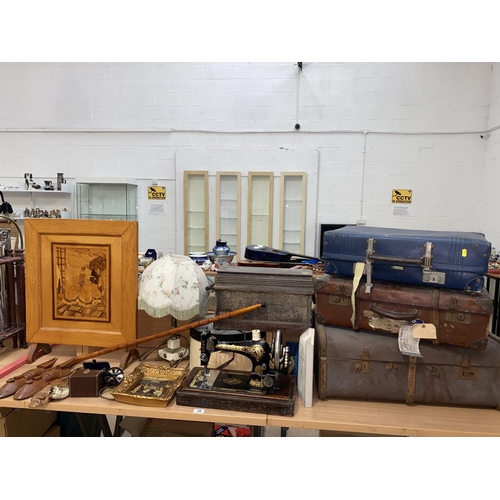 30 - A Singer sewing machine in wooden case, vintage suitcases, wooden fire screen, lamp etc.
