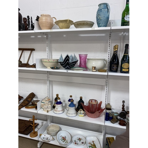 52 - Mixed glass and china including Royal Worcester, Wade  empty Whisky bottles etc- 4 shelves