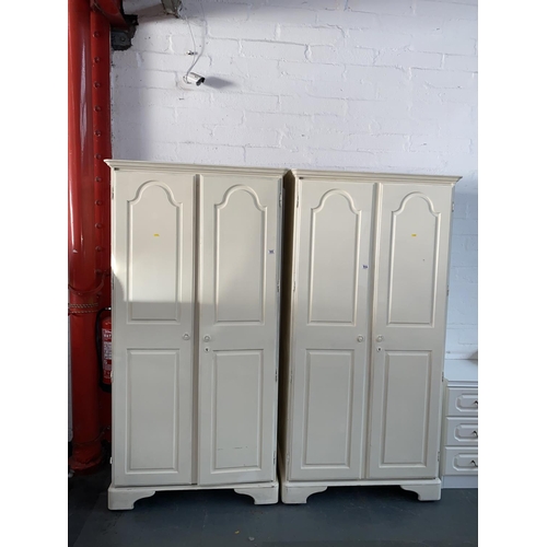 500 - Two painted pine ducal double wardrobes