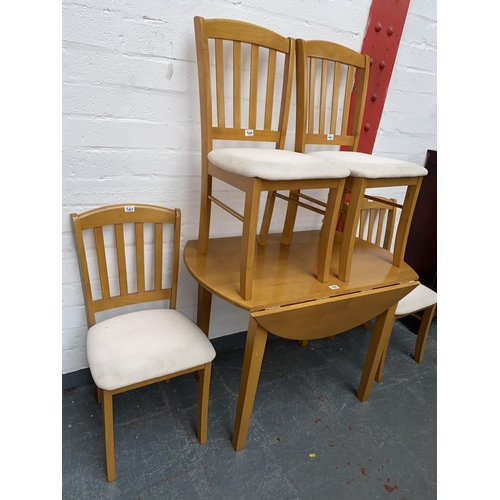 504 - A drop leaf dining table and four chairs