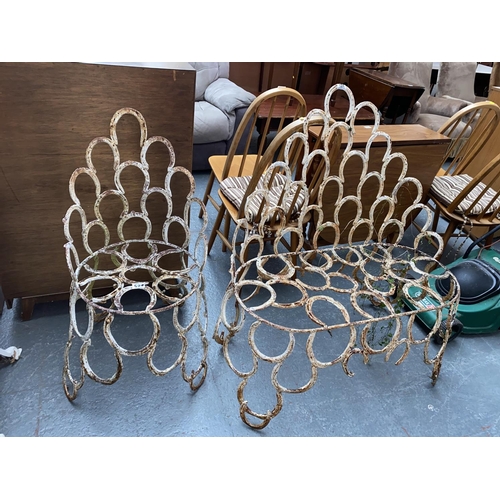 524 - A metal horseshoe two seater bench and chair