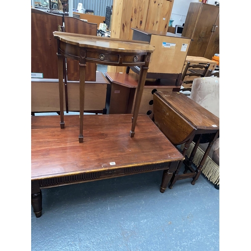 549 - A pine coffee table, drop leaf table and a hall table