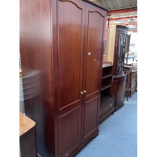 545 - A Stag wardrobe, bookcase and a corner cabinet