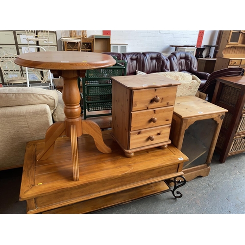 360 - Two pine tables, bedside cabinets and display cabinet