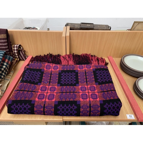 11 - A purple and pink Welsh blanket with no signs of staining or damage