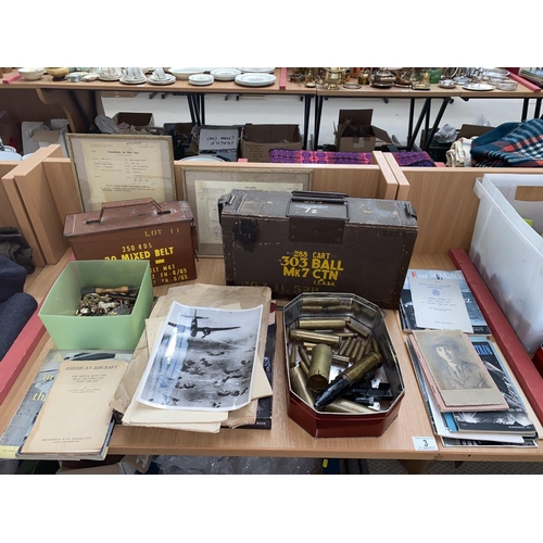 3 - Military cartridge boxes, shell casings, buttons and badges, books and photographs etc.