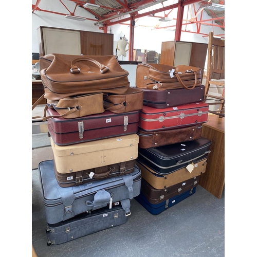 319 - A quantity of suitcases