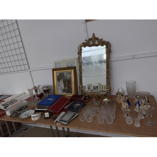 47 - A gilt framed mirror, cut crystal glasses, figurines etc.