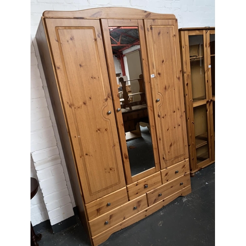 313 - A pine wardrobe with mirror and drawers
