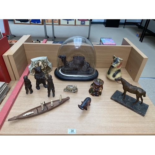 38 - A carved wooden camel under glass dome, bronze bear money box, bronze horse figurine etc.
