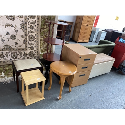 331 - A filing cabinet, side tables, nest of tables, ottoman etc.