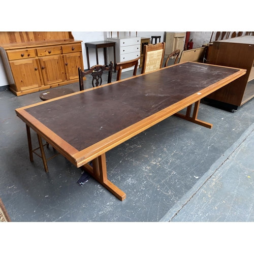 340 - A teak conference table with leather top