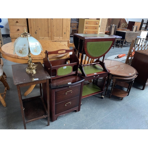 559 - A circular nest of tables, bedside cabinet , drop leaf table etc.
