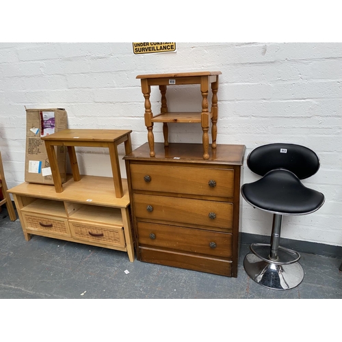 503 - A pine TV unit, three drawer chest of drawers, bar stool, two side tables and a boxed two drawer uni... 