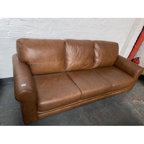 511 - A brown leather 3 seater sofa