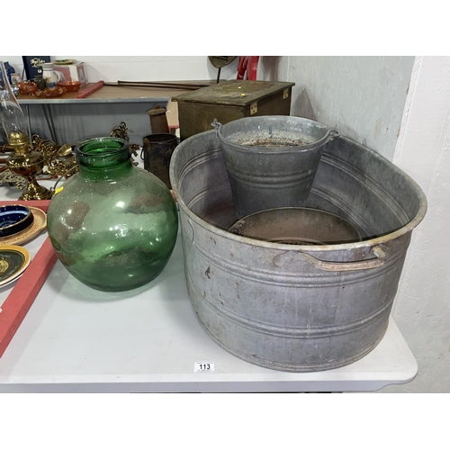 113 - A galvanised tin bath, bucket, glass carboy etc