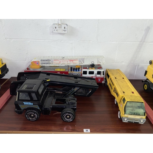 88 - Tonka mighty car transporter, Tonka fire truck and a Tonka car carrier