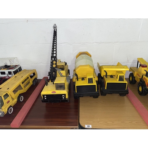 89 - Tonka mighty truck crane, cement mixer truck and dump truck