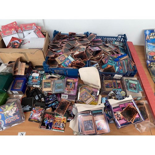 74 - A large quantity of Yu-Gi-Oh gaming cards, Duel Masters gaming cards, Duel Masters score pads etc.