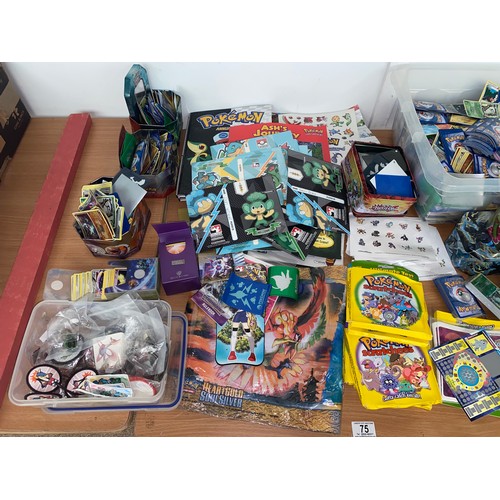 75 - A large quantity of vintage Pokemon gaming cards - loose and in sealed packs , Pokemon pin badges an... 