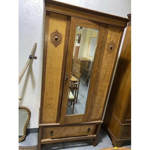 117 - An oak single door wardrobe with drawer