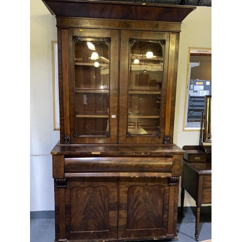 119 - A mahogany secretaire bookcase (some veneer damage)