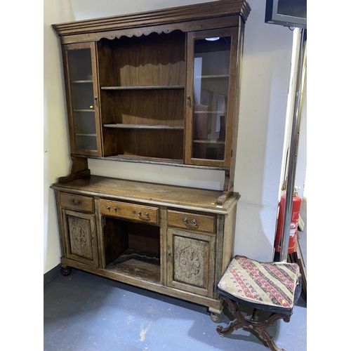 123 - An oak dresser and an early x frame stool