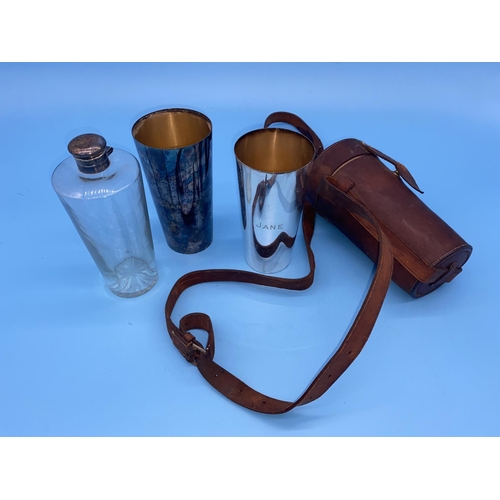 172 - An antique hunting flask with two gilded beakers in original leather case. The two beakers engraved ... 