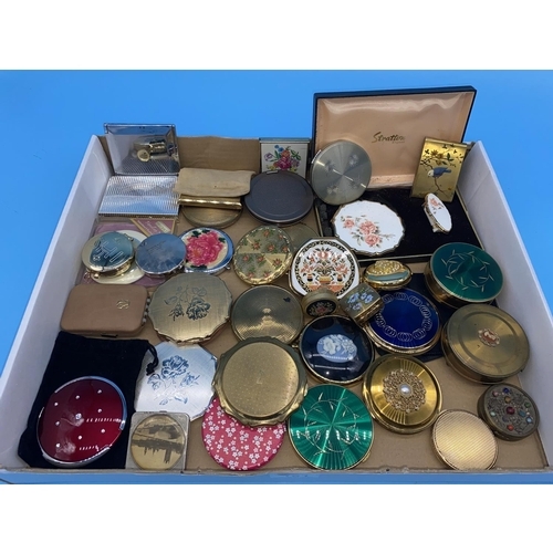 181 - A collection of vintage powder compacts and mirrors including Stratton, Margaret Rose etc