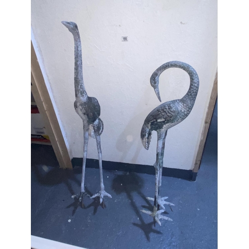 180 - A pair of heavy cast metal garden ornamental storks
