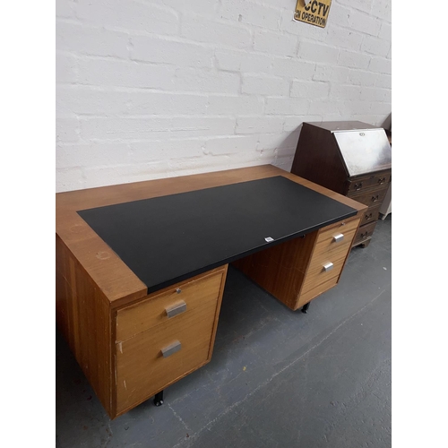 500 - Twin pedestal teak desk with black leatherette insert