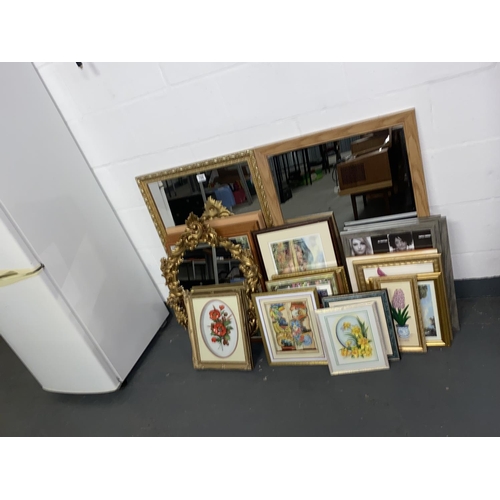 708 - A quantity of framed pictures and mirrors