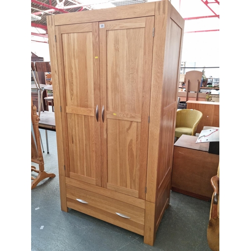 526 - A pine double wardrobe with single drawer