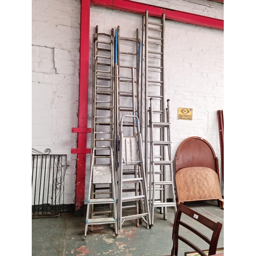 540 - A quantity of aluminium and wooden ladders