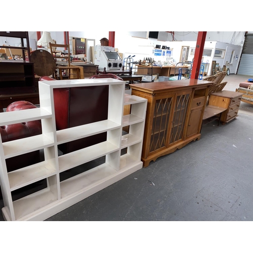 521 - A painted bookcase, chest of drawers, sideboard and a coffee table