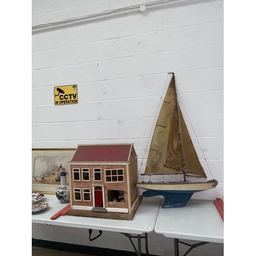 6 - A vintage wooden model sailboat and dolls house