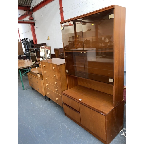 527 - A retro chest of drawers and matching dressing table and a teak display cabinet