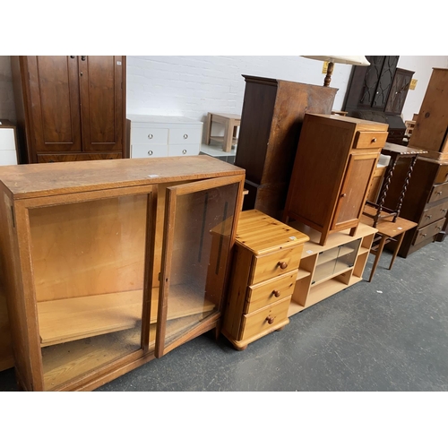 533 - An oak glass fronted bookcase, pine bedside cabinet, retro bedside cabinet etc.