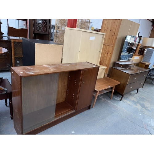 558 - A Remploy bookcase, retro coffee table and dressing table with mirror