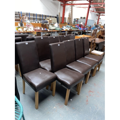 568 - 9 faux leather dining chairs