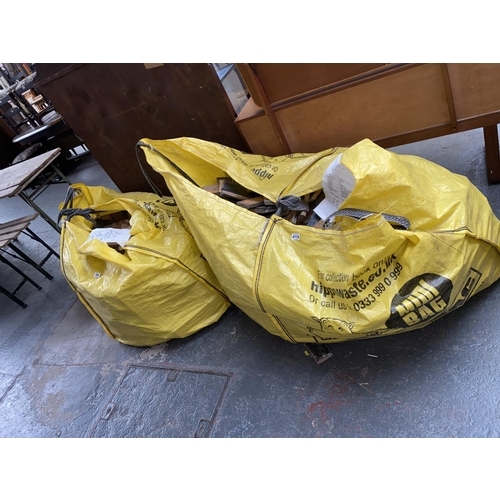 698 - Two ton bags of parquet- block flooring, pitch pine