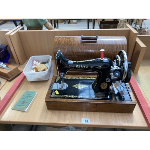 14 - A Singer hand crank sewing machine no 99 in case with key and accessories