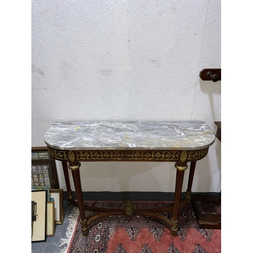 83 - A Louis XV style marble topped hall or console table with applied gilt cast metal mounts throughout-... 