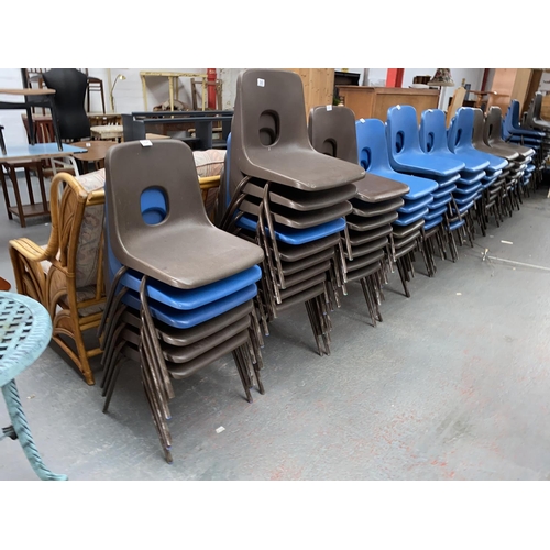 549 - A large quantity of stacking school chairs