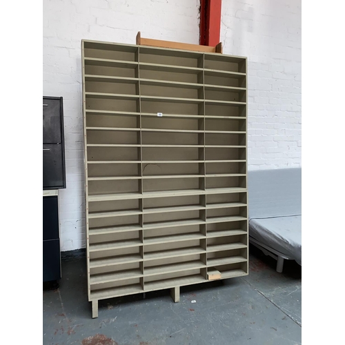 555 - A quantity of wooden pigeon hole style shelving